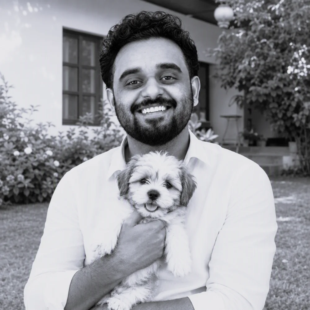 Usama Munir, founder of DesignDusk, holding his dog outdoors