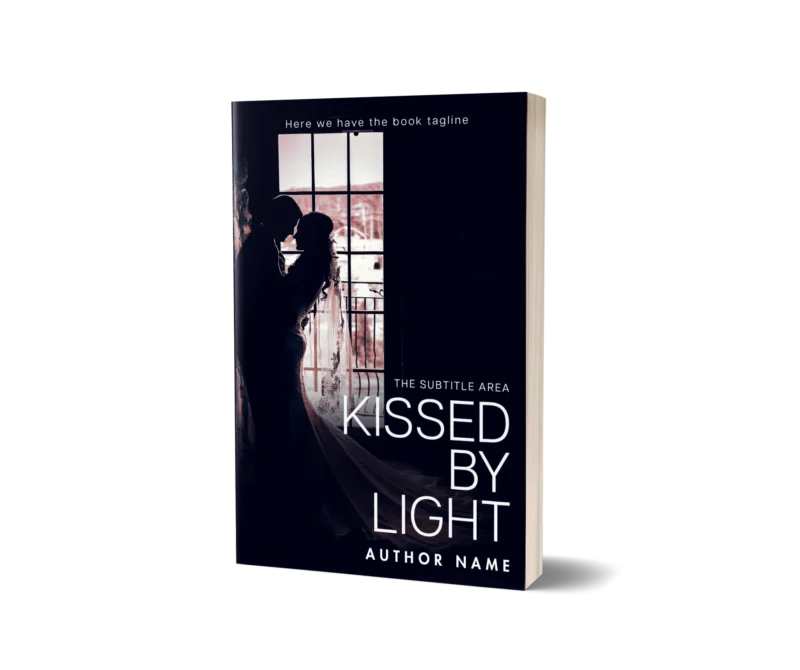 A romantic book cover mockup titled 'Kissed by Light' depicting a silhouette of a couple sharing a tender moment by a window