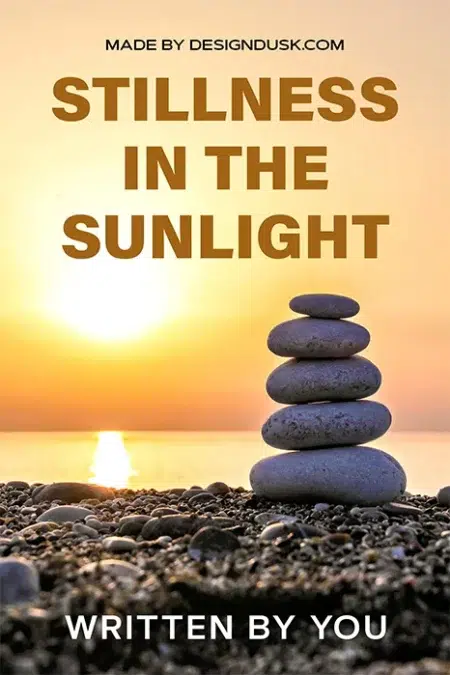 Stacked zen stones on a rocky beach at sunrise with a golden sun over calm water