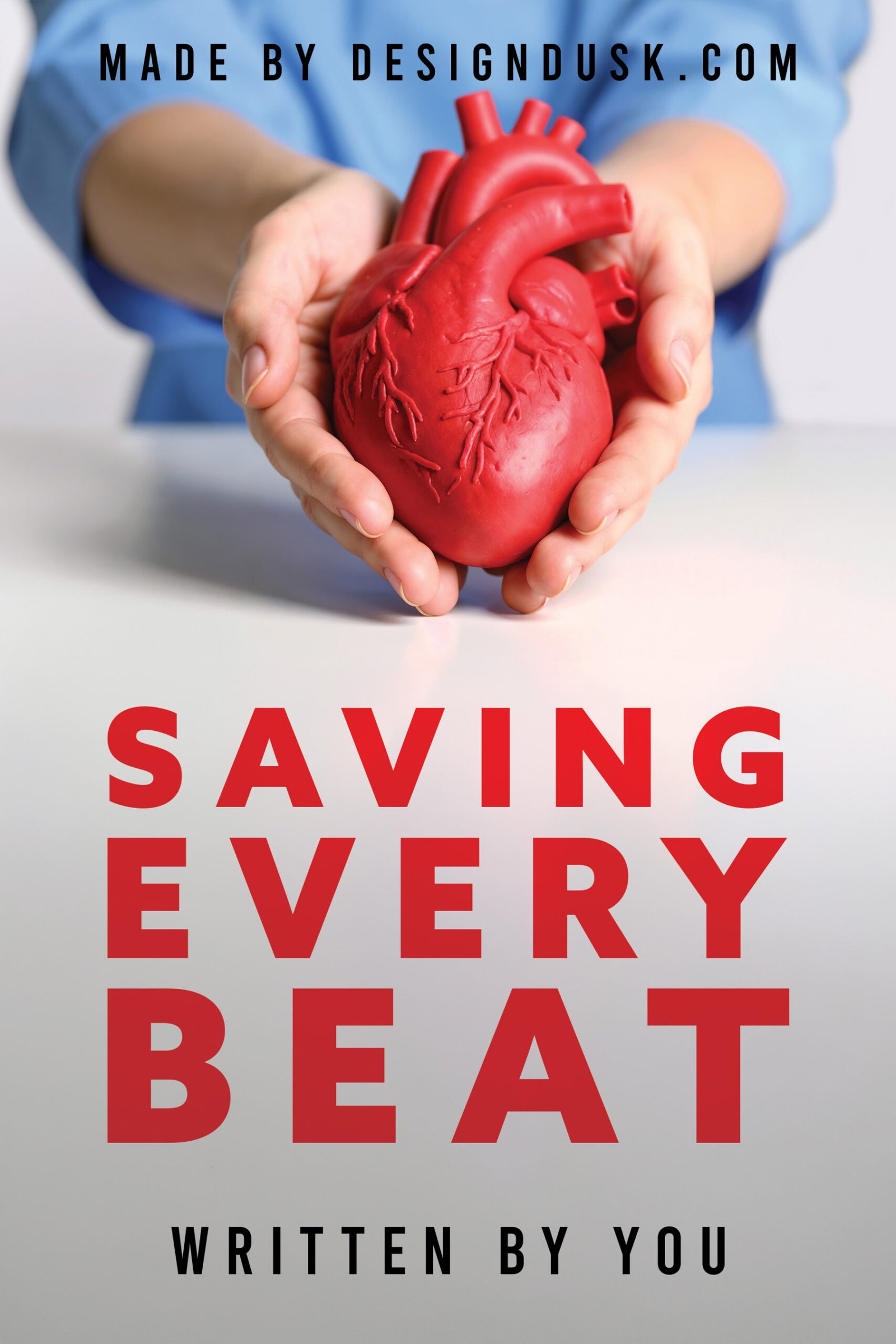 A medical professional in blue scrubs carefully holds a large red anatomical heart model in both hands.